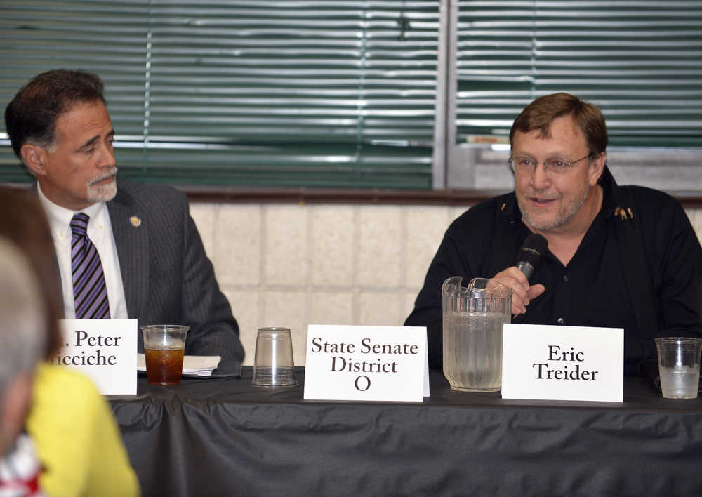 Photo by Dan Balmer/Peninsula Clarion State Senate District O independent candidate Eric Treider and incumbent Sen. Peter Micciche, R-Soldotna, discuss their goals if elected during a debate at a Kenai/Soldotna Chamber Luncheon Tuesday at the Soldotna Regional Sports Complex.