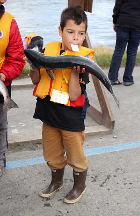 Kids and guides come off the Kenai RIver at the end of the Boys & Girls Clubs of the Kenai Peninsula and the Kenai River Foundation's Take Our Kids Fishing event on Thursday at Centennial Park in Soldotna. Photo by Kaylee Osowski/Peninsula Clarion