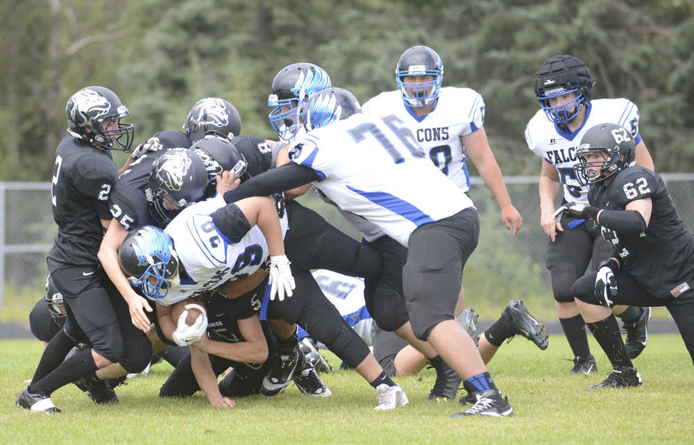 Photo by Kelly Sullivan/ Peninsula Clarion Kyrel Payne number 38, Luke Johnson number 8