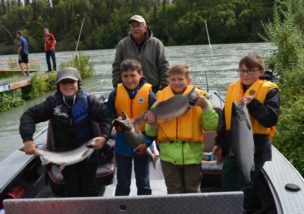 A boatload of happy young anglers show off their catch during the Kenai River Jr. Classic. (Photo courtesy Kenai River Sportfising Association)
