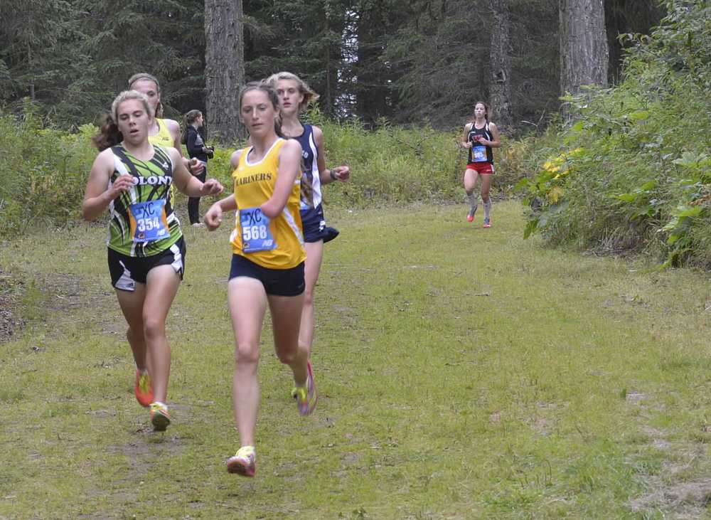 Photo by Jeff Helminiak Megan Pitzman of Homer leads a group of runners down a hill midway through the Tsalteshi Invitational on Saturday at Tsalteshi Trails. Pitzman finished sixth to lead the Mariners to third in the team standings.