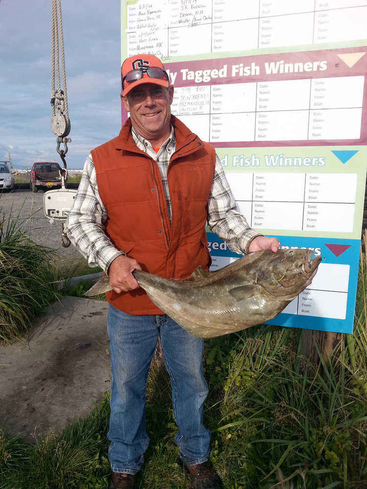 Andrew VanderPlaat of Pendleton, Oregon, onboard DeepStrike Sportfishing's Grand Aleutian with Captain David Bayes, won $500 when he caught a 12.6 pound tagged halibut. (Photo courtesy Homer Chamber of Commerce)