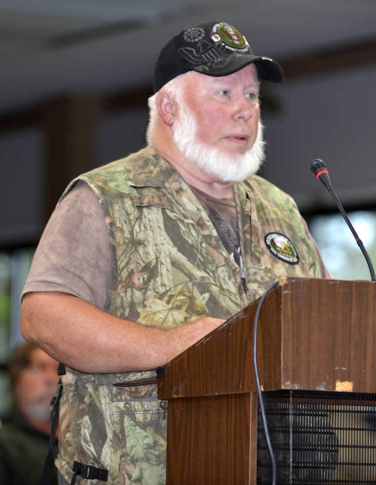 Photo by Dan Balmer/Peninsula Clarion Soldotna resident Floyd Frost testifies against the proposed closure of sport hunting of brown bears on the Kenai National Wildlife Refuge at a public hearing Wednesday night at the Soldotna Regional Sports Complex. More than 60 people attended the hearing. A final decision by the refuge is expected to be made today.