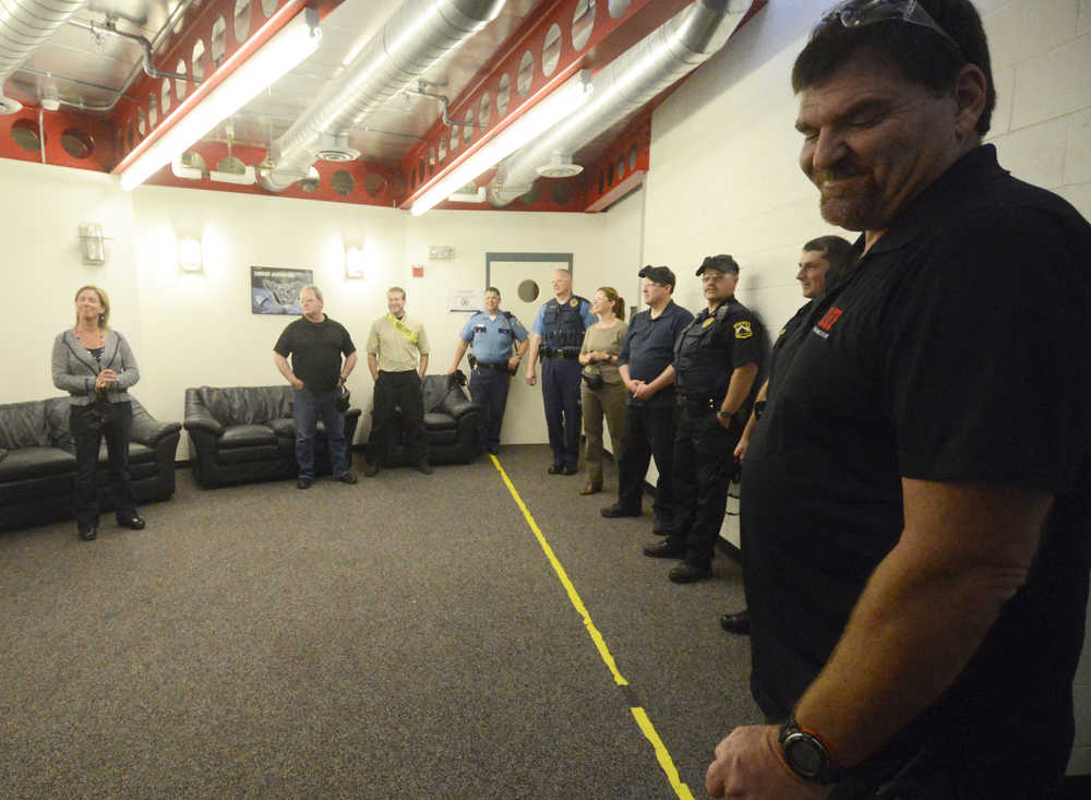 Photo by Kelly Sullivan/ Peninsula Clarion Greg Crane, who co-founded the ALICE Training Institute with his wife LIsa Crane, address Friday's group of Kenai Peninsula municipal officers and Alaska State Troopers, Friday, August 29, 2014 at the Challenger Learning Center of Alaska in Kenai, Alaska.