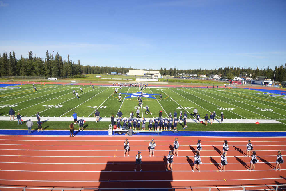 Photo by Kelly Sullivan/ Peninsula Clarion Soldotna High Schools kicks off the first game on the new track and field , Saturday, August 30, 2014 during the varsity game against Thunder Mountain high school at Soldotna High School in Soldotna, Alaska.