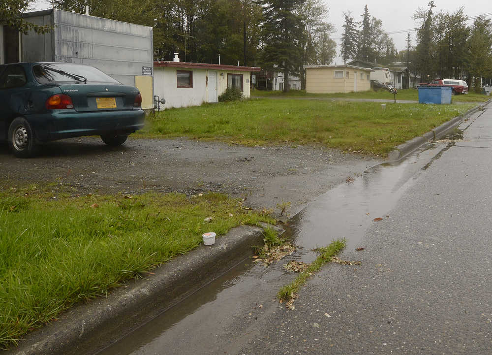 Photo by Rashah McChesney/Peninsula Clarion A row of propertys along Peninsula Avenue Thursday September 4, 2014 in Kenai, Alaska. The city recently bought properties near a crumbling bluff along the Kenai River where erosion mitiation efforts are set to begin.