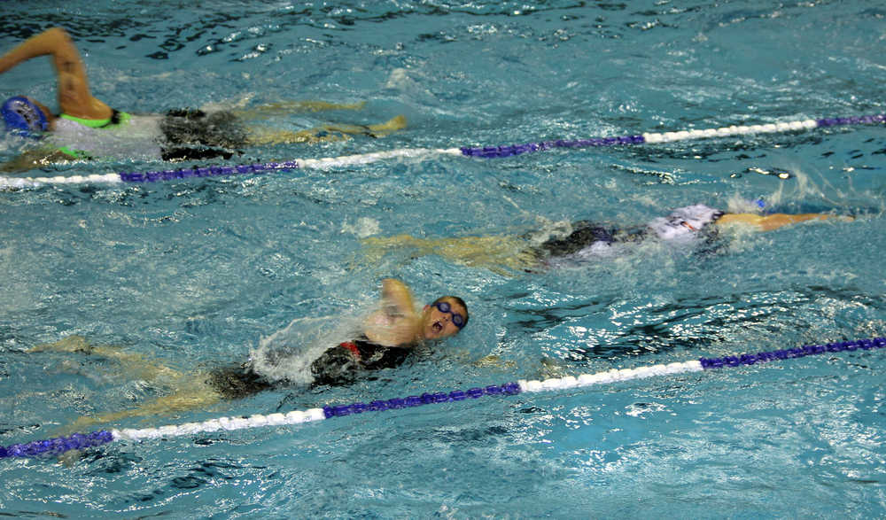 Photo by Dan Balmer/Peninsula Clarion Athletes swim 500 meters for the first leg of the Tri the Kenai triathlon race Sunday at Skyview Middle School.