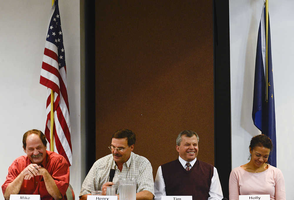 Photo by Rashah McChesney/Peninsula Clarion  Kenai City Council candidates Mike Boyle, Henry Knackstedt, Tim Navarre and Holly Spann laugh during a chamber luncheon and forum Wednesday September 10, 2014 at the Kenai Visitors and Cultural Center in Kenai, Alaska.