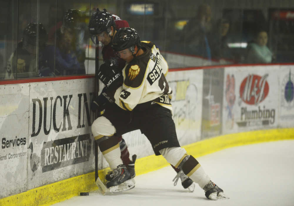 Photo by Kelly Sullivan/ Peninsula Clarion Kenai Brown Bears' Will Schwartz collides with Fairbanks Ice Dogs' player to take control of the puck, Friday, September 12, 2014, at the Soldotna Regional Sports Complex in Soldotna, Alaska.