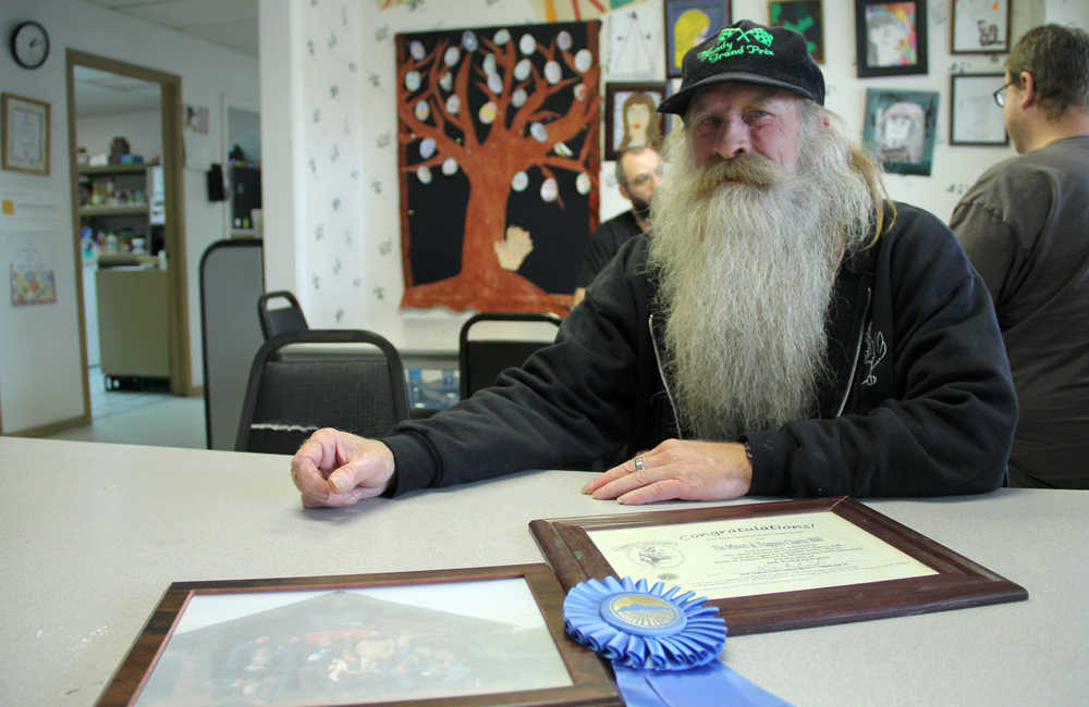 Jerry Terp, 59, of Kenai, won the Colonist category at this year's Alaska State Fair's Great Alaska Beard Contest in Palmer. Terp was severely burned in a house fire in October 2010. Since the fire, his facial hair has now grown back enough to allow him to compete in beard contests again. On Friday, Sept. 12, the staff and clients at Birchwood Center in Soldotna, where Terp receives assistance, celebrated his blue ribbon win. Photo by Kaylee Osowski/Peninsula Clarion