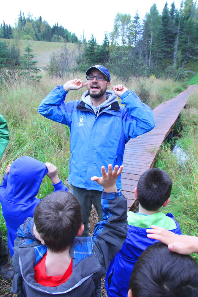 Photo by Kelly Sullivan/ Peninsula Clarion Kenai Watershed Forum's Educational Specialist Dan Pascucci took the students of Sara Boersma and Robyn Zinszer at the Kaleidoscope School of Arts and Science for a walk on the Shqui Tsatnu Creek Trails, Wednesday, September 17, 2014 in Kenai, Alaska.