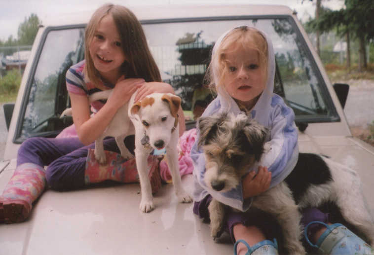 Karen Boudreau shared this photo of her granddaughters, Jasmine and Sophia Husar of Soldotna, hanging out on the hood of her car with her Jack Russell terriers Libby and her puppy Pirate, visiting from California.