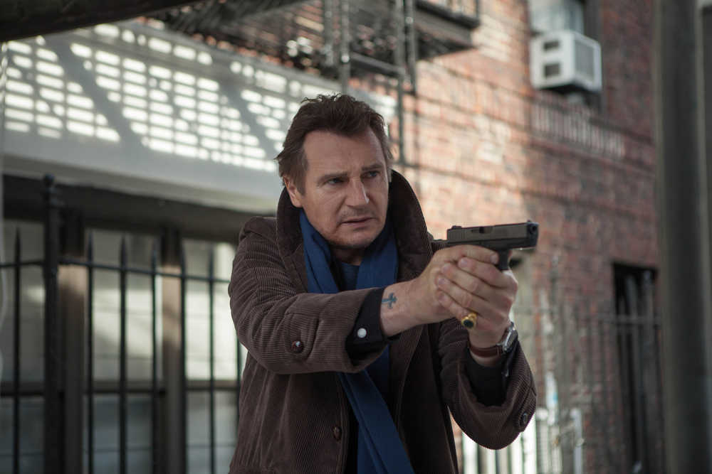 This photo released by Universal Pictures shows Liam Neeson,  as Matt Scudder, in a scene from the film, "A Walk Among the Tombstones."  (AP Photo/Universal Pictures, Atsushi Nishijima)