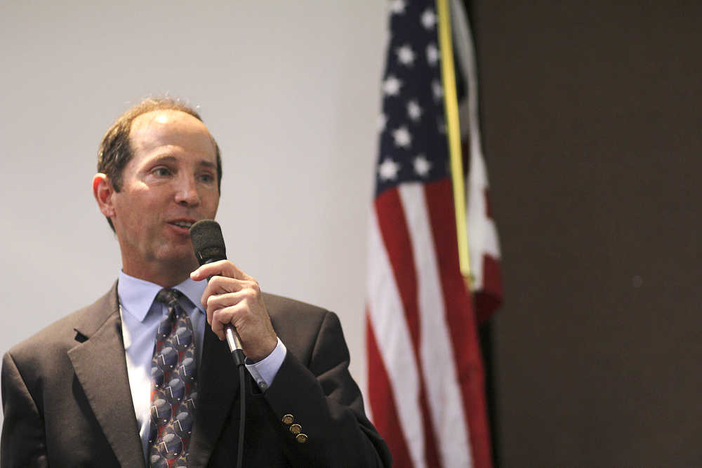 Photo by Rashah McChesney/Peninsula Clarion  Kenai Peninsula Borough Mayor Mike Navarre talks to a crowd during a borough mayor candidate forum at a Kenai and Soldotna Chambers of Commerce joint luncheon Wednesday September 3, 2014 in Kenai, Alaska.  Navarre faces two challengers for his position.