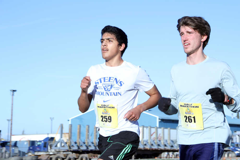 Pedro Ochoa (left), of Homer, and Allan Spangler, of Anchorage, run the half marathon during the Kenai River Marathon in Kenai on Sunday.  Photo by Kaylee Osowski/Peninsula Clarion