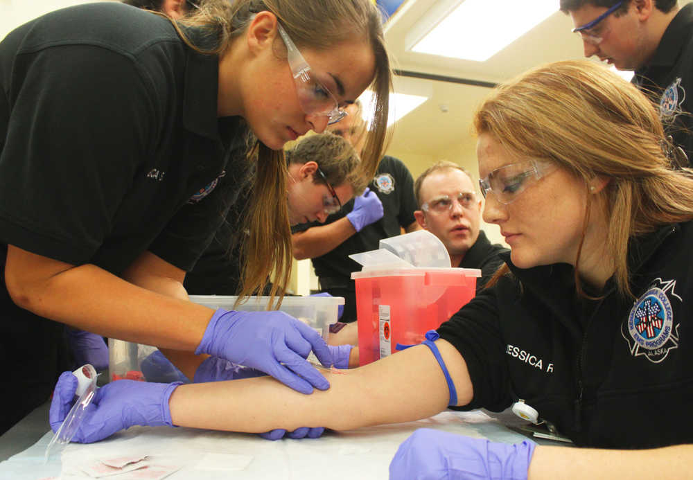 Photo by Kelly Sullivan/ Peninsula Clarion This year's Paramedic Technology students practiced intramuscular, intravenous and subcutaneous injections on their peers Monday, September 29, 2014, at the Kenai Peninsula College in Soldotna, Alaska.
