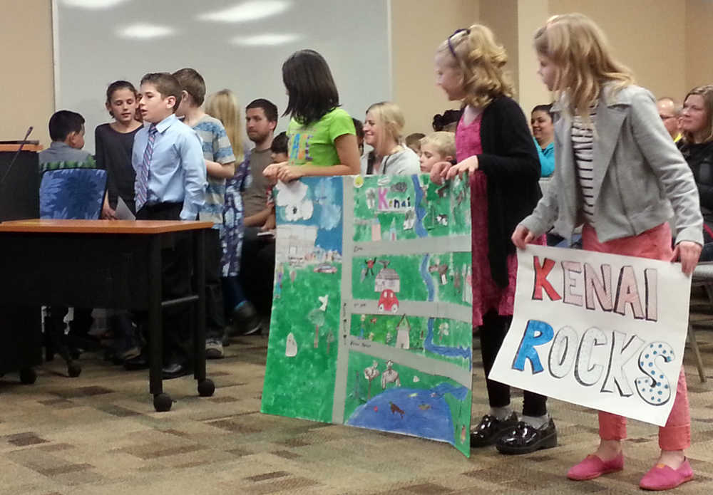 Photo by Dan Balmer/Peninsula Clarion Students from Kaleidoscope School of Arts and Science share their concerns of the amount of trash in storm drains and along Shqit Tsatnu Creek at Wednesday's Kenai City Council meeting. The students requested permission to spray paint, "Keep it clean by the stream" on city storm drains.