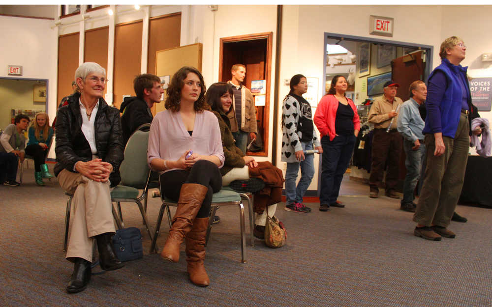 Photo by Kelly Sullivan/ Peninsula Clarion Visitors attended the opening reception at the Voices of the Wilderness travelling art show that opened at the Kenai Visitors and Cultural Center, part of the Kenai Wildlife Refuge's yearlong celebration of the 50th Anniversary of the Wilderness Act, Friday, October 3, 2014, at the Kenai Visitor and Cultural Center in Kenai, Alaska.