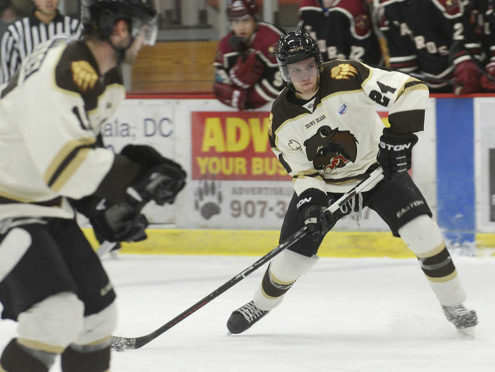 Photo by Rashah McChesney/Peninsula Clarion  Kenai River Brown Bears defenseman Collin Charyszyn shoots during a game against the Minot, North Dakota Minotauros during their game Friday October 3, 2014 in Soldotna, Alaska. The Bears won the game 2-1 in a shootout.