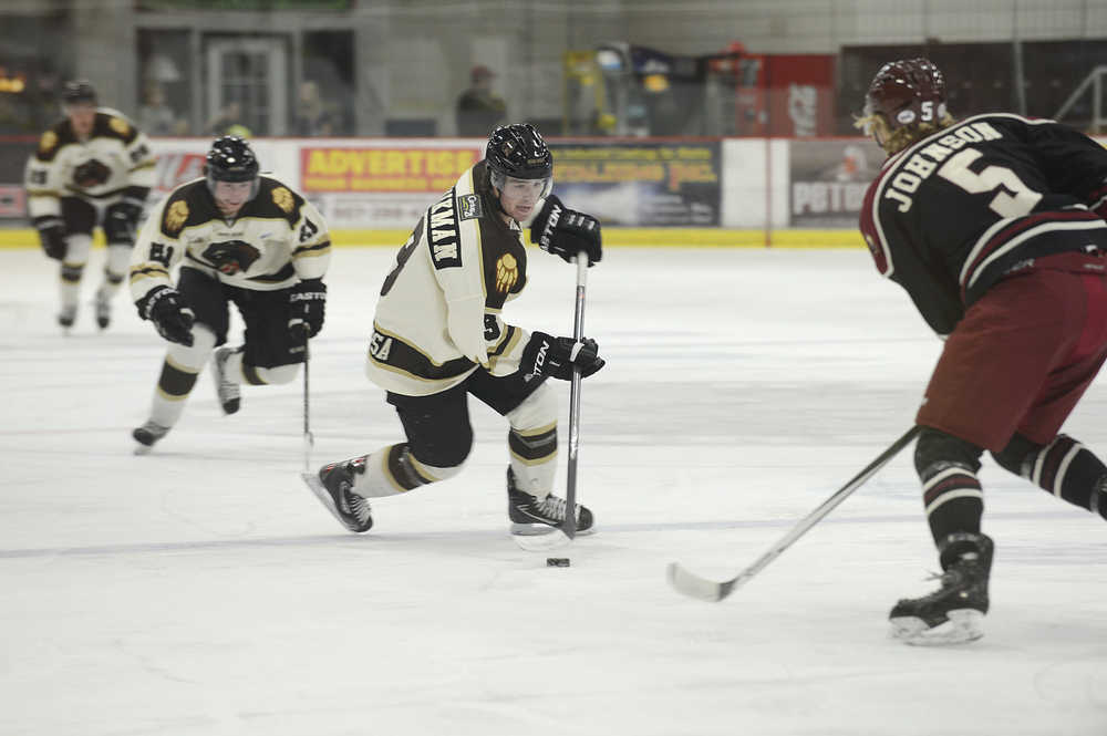 Photo by Rashah McChesney/Peninsula Clarion  Kenai River Brown Bears forward Matt Wikman looks for an opening during a game against the Minot, North Dakota Minotauros Friday October 3, 2014 in Soldotna, Alaska. The Bears won the game 2-1 in a shootout.
