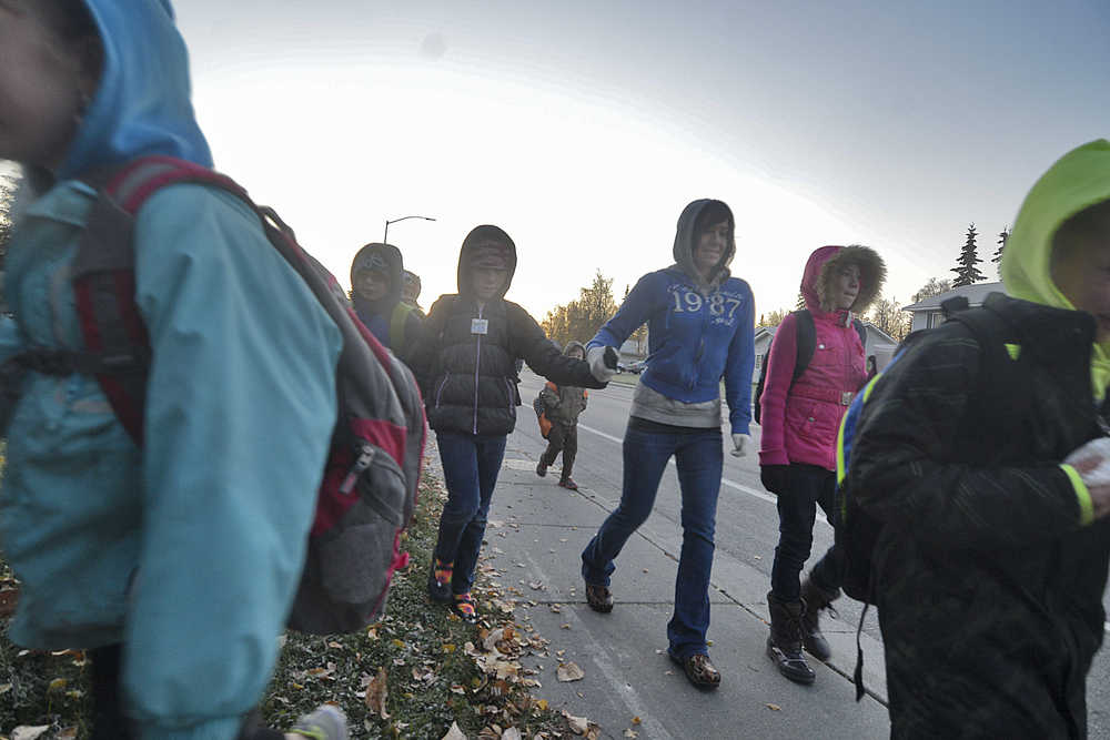 Photo by Rashah McChesney/Peninsula Clarion  More than 150 students, parents, teachers and administrators walked to school during the annual Walk Your Kids to School Day Wednesday October 1, 2014 in Soldotna, Alaska.