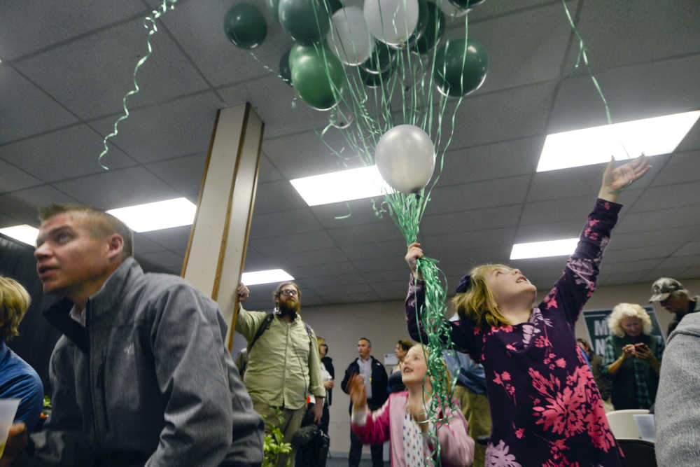 Photo by Rashah McChesney/Peninsula Clarion  Cora O'Connor, 6, collects ballloons during Kenai Peninsula Borough Mayor candidate Mike Navarre's election night party on Tuesday October 7, 2014 in Soldotna, Alaska.