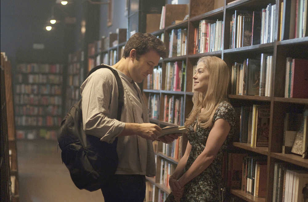 In this image released by 20th Century Fox, Ben Affleck, left, and Rosamund Pike appear in a scene from "Gone Girl." The film, based on the best-selling novel, releases Friday, Oct. 3, 2014. (AP Photo/20th Century Fox, Merrick Morton)