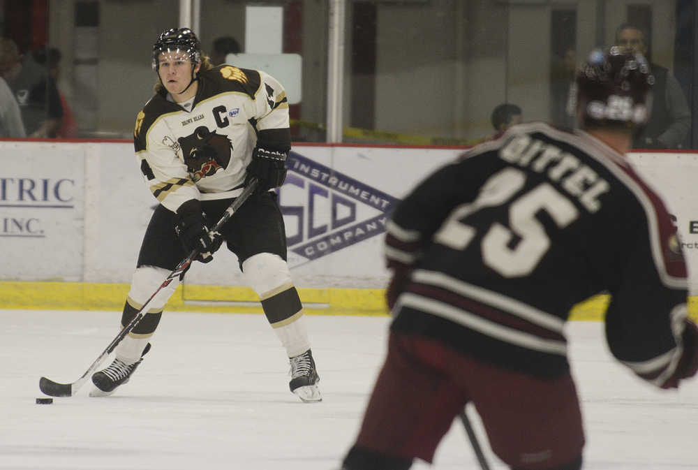 Photo by Rashah McChesney/Peninsula Clarion  Kenai River Brown Bears' Tyler Andrews looks for an opening during a game against the Minot, North Dakota Minotauros October 3, 2014 at the Soldotna Sports Complex in Soldotna, Alaska.