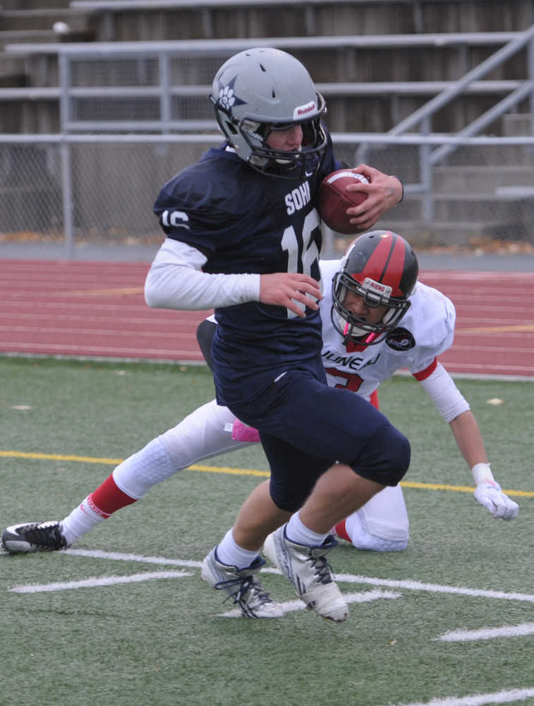 SoHi's Jace Urban scores on a pass play, beating Juneau's Manase Maake.  Photo by Michael Dinneen for the Clarion.