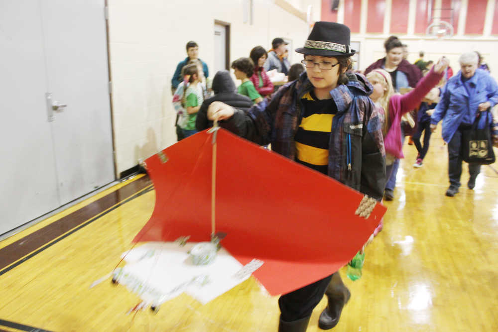 Photo by Kelly Sullivan/ Peninsula Clarion Gabriel Miller, a member of The Sci-Fighters from Ninilchik School that competed in the Mind A-Mazes carries his team's Long-Term Problem structure Saturday, October 11, 2014, at Soldotna Prep School in Soldotna, Alaska.