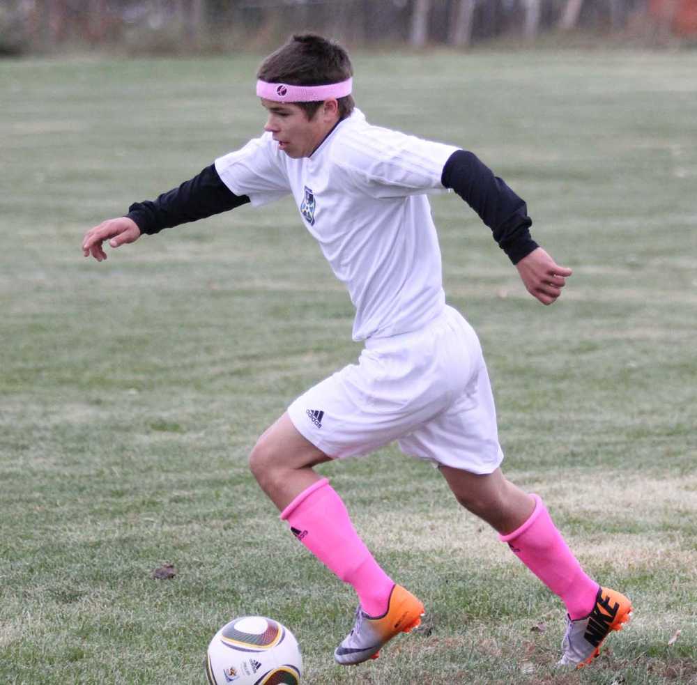 Photo by Jeremiah Bartz/Mat-Su Valley Frontiersman Cook Inlet Academy's Johnny Smithwick dribbled the ball up the field Friday against Wasilla Lake Christian in Wasilla.