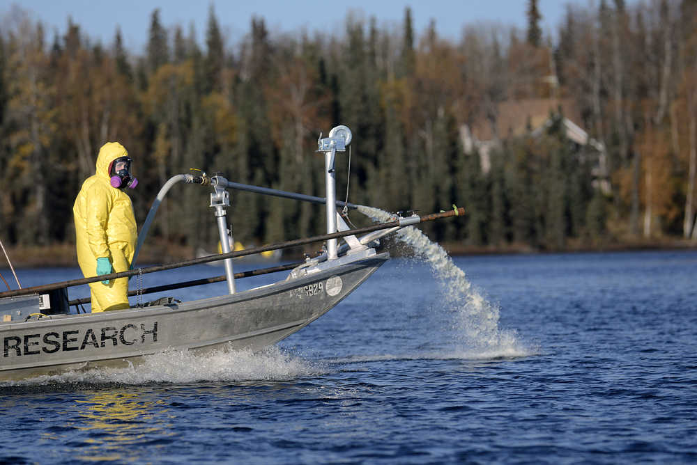 Photo by Rashah McChesney/Peninsula Clarion An interagency team worked with the Alaska Department of Fish and Game to apply the fish-killing poison rotenone to East Mackey Lake Wednesday October 8, 2014 in Soldotna, Alaska. The lake was one of four treated as part of a four-year project aiming to eradicate invasive northern pike from the Soldotna Creek drainage.