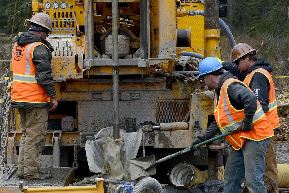 Photo by Rashah McChesney/Peninsula Clarion A group works to obtain a soil sample near Autumn Road in October 9, 2014 in Nikiski, Alaska. Teams have been doing geotechnical work in the Nikiski were the Alaska LNG project has proposed locating an LNG facility to cool natural gas into a liquid form for export.