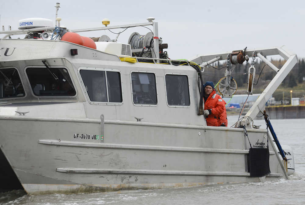 Photo by Rashah McChesney/Peninsula Clarion  A survey boat circles near the Kenai City Docks in the Kenai River on Thursday Oct. 9, 2014 in Kenai, Alaska. Alaska LNG has hired surveyors to make detailed underwater maps of certain areas of the Cook Inlet.