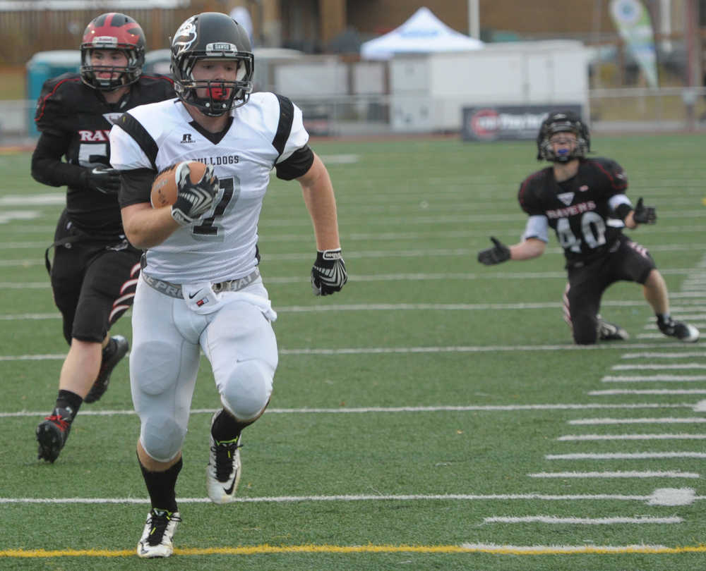 Nikiski's Chrisitan Riddall runs for the Bulldog's first touchdown.  Photo for the Clarion by Michael Dinneen