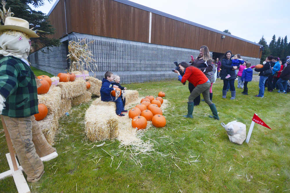 Photo by Kelly Sullivan/ Peninsula Clarion Annie Massey, Secretary for the Kalifornsky Beach Elementary PTA said she had a line for families wanting photos for two straight hours during the schools first "Pumpkins in the Playground," event Thursday, October 16, 2014, at Kalifornsky Beach Elementary in Soldotna, Alaska.
