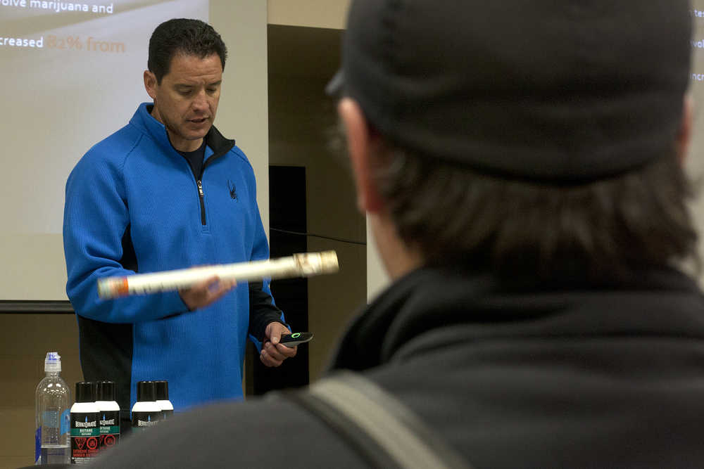 Photo by Rashah McChesney/Peninsula Clarion Aurora, Colorado Fire Department Capt. Siegfried Klein talks about the paraphernalia used to make hash oil, a cannabis product, during a presentation to Central Emergency Services firefighters Wednesday October 22, 2014 in Soldotna, Alaska.