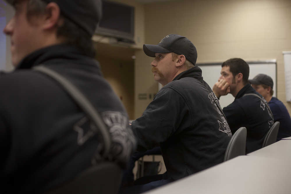 Photo by Rashah McChesney/Peninsula Clarion  CES firefighter Dan Jensen and others listen to a presentation on fires caused during the process of making hash oil, a form of cannabis, and how to fight them Wednesday October 22, 2014 in Soldotna, Alaska.