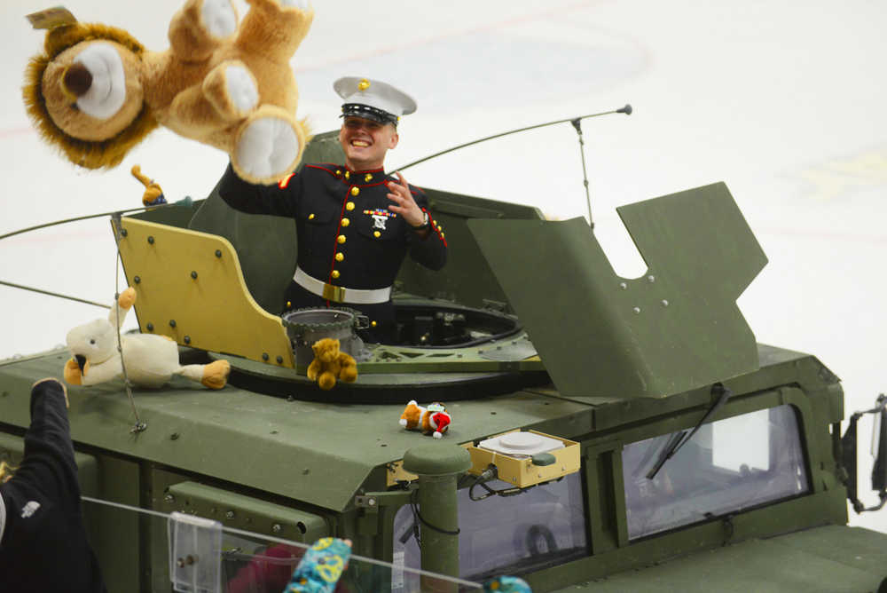 Photo by Kelly Sullivan/ Peninsula Clarion Lance Corporal Jeff Melvin took on the job of catching the stuffed animals from attendees at the Friday Kenai Brown Bears Game during the sixth annual Toys for Tots fundraiser at the Soldotna Regional Sports Complex in Soldotna.