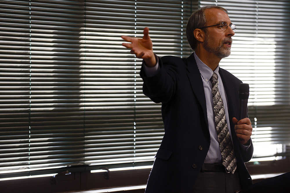 Photo by Rashah McChesney/Peninsula Clarion  Larry Persily, federal coordinator in the Federal Office for Alaska Gas Line Projects, speaks about the environmental assessment needed for the Alaska LNG project to progress Tuesday October 28, 2014 in Soldotna, Alaska.