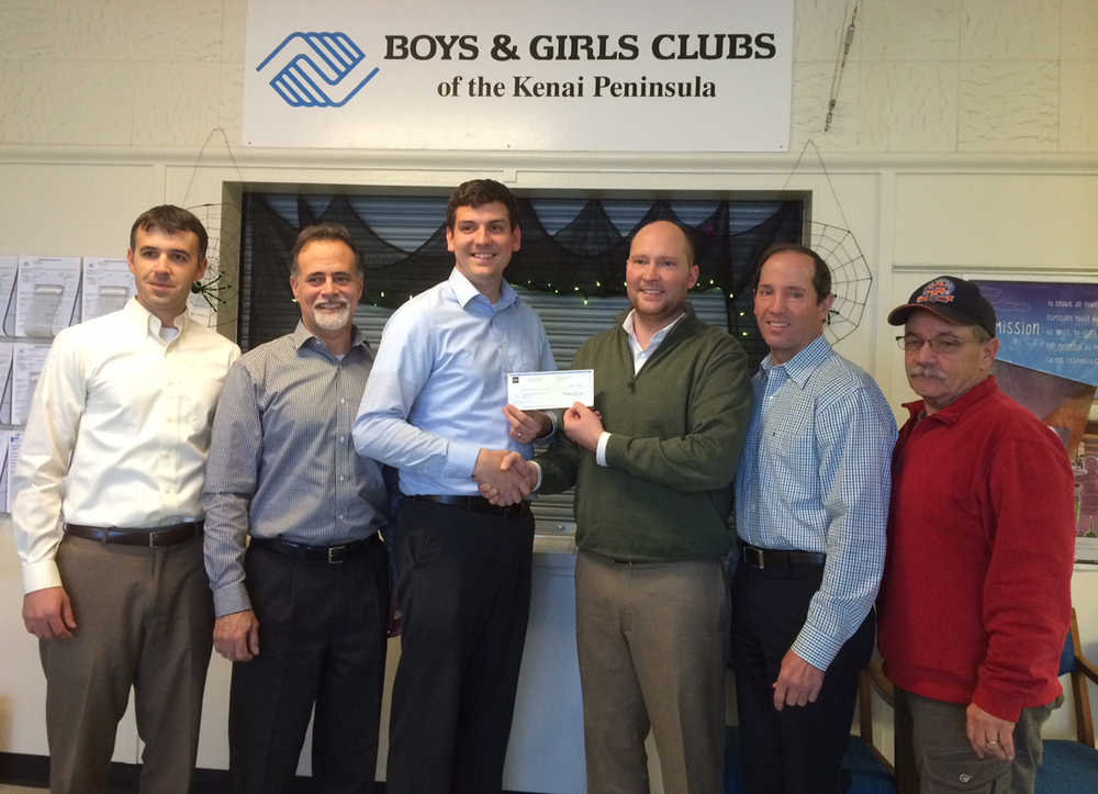 Wells Fargo presents a $3,000 grant to Boys and Girls Club of Kenai Peninsula to support the organization's annual fundraiser to be held Nov. 15 in Kenai. Pictured from left to right are: Tim Redder, Boys & Girls Club board member, Wells Fargo Kenai Peninsula business banking manager; Peter Micciche, Boys & Girls Club board member, state senator; Tyler Davis, Wells Fargo Kenai business relationship manager; Ryan Tunseth, Boys & Girls Club board president; Mike Navarre, Boys & Girls Club board member, Kenai Peninsula Borough Mayor; and James Montgomery, Boys & Girls Club board member.