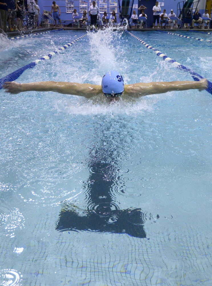 Photo by Rashah McChesney/Peninsula Clarion Soldotna High School's Cody Watkins swims during the 100-yard freestyle competition during the Region III swimming and diving meet Saturday November 1, 2014 in Soldotna, Alaska.