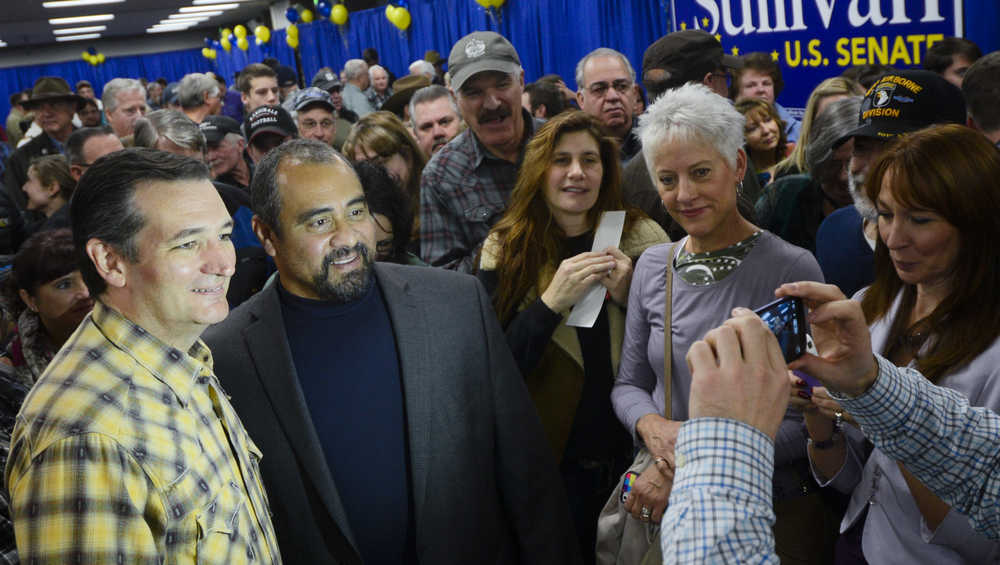 Photo by Rashah McChesney/Peninsula Clarion  Sen. Ted Cruz, R-Texas, poses for a photograph with an audience member after a stump speech for Alaska Senate Candidate Dan Sullivan on Sunday Nov. 2, 2014 in Soldotna, Alaska.