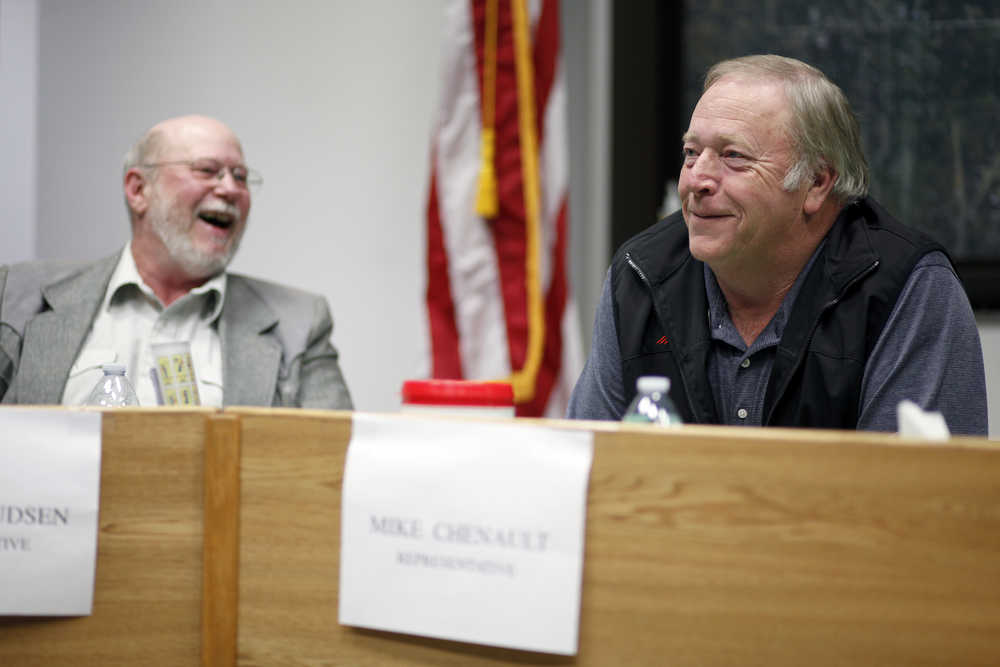 Photo by Rashah McChesney/Peninsula Clarion Candidates for House District 29 Rocky Knudsen and Mike Chenault share a laugh during a Central Kenai Peninsula League of Women Voters debate on Thursday Oct. 30, 2014 in Soldotna, Alaska.