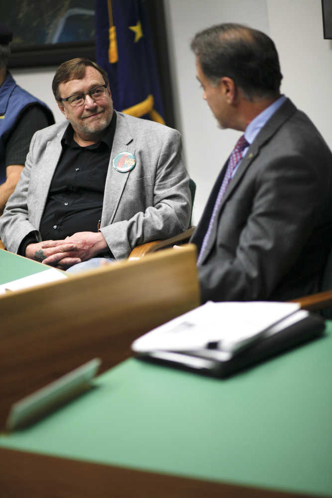 Photo by Rashah McChesney/Peninsula Clarion Eric Treider, candidate for State Senate District O, looks at incumbent Peter Micciche as the two discuss their political experience during a Central Kenai Peninsula League of Women Voters debate on Thursday Oct. 30, 2014 in Soldotna, Alaska.