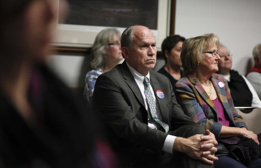 Photo by Rashah McChesney/Peninsula Clarion  Gubernatorial candidate Bill Walker watches a Central Peninsula League of Women Voters candidate debate on Thursday Oct. 30, 2014 in Soldotna, Alaska.