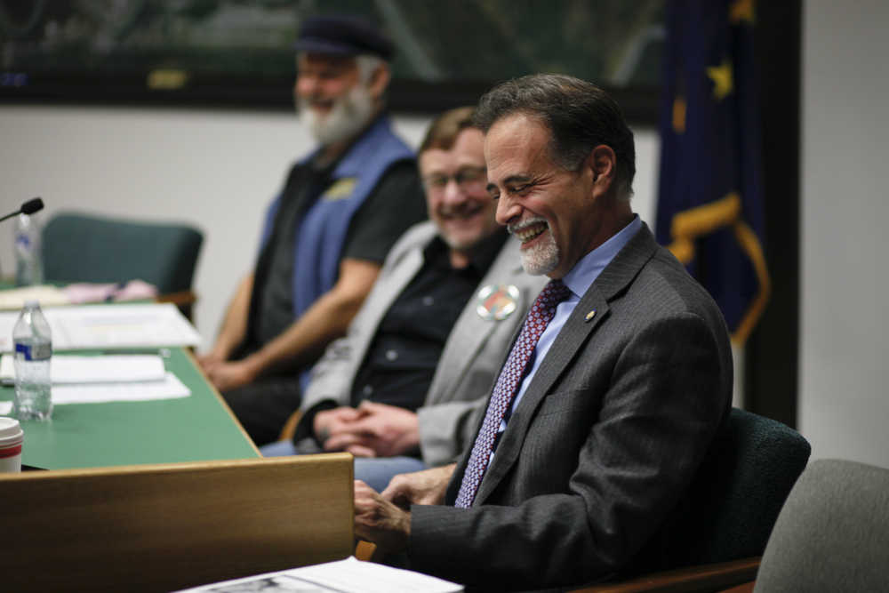 Photo by Rashah McChesney/Peninsula Clarion  Sen. Peter Micciche, R-Soldotna, laughs at a joke his challenger for Senate District O, Eric Treider, made during a Central Peninsula League of Women Voters debate on Thursday Oct. 30, 2014 in Soldotna, Alaska.