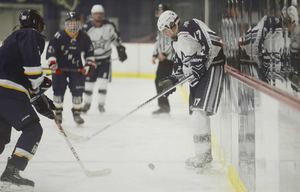 Photo by Kelly Sullivan/ Peninsula Clarion Soldotna Stars' Levi Hensley beats the Homer Mariners to the puck, Thursday, Nov. 6, 2014, at the Soldotna Regional Sports Complex in Soldotna, Alaska.