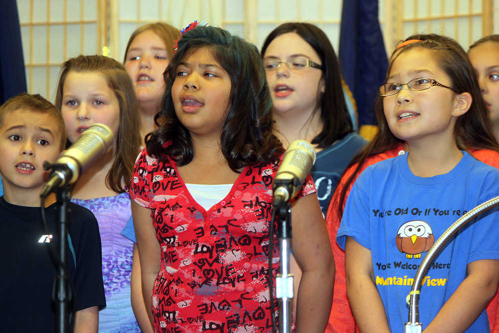 Photo by Dan Balmer/Peninsula Clarion Students with the Mountain View Elementary School Choir sing patriotic songs Monday, Nov. 10, 2014 at the Kenai Senior Center. The concert was part of a evening of festivities to celebrate and remember veterans.