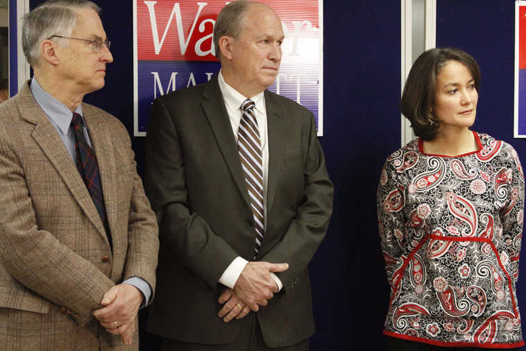 Bill Walker, an independent candidate for Alaska governor, center, is flanked by the co-chairs of his transition team, former state Sen. Rick Halford, left, and Ana Hoffman of Bethel, during a news conference Wednesday, Nov. 12, 2014, in Anchorage, Alaska. Walker leads incumbent Republican Gov. Sean Parnell by about 4,000 votes with thousands of absentee ballots to be counted starting later this week. Walker held the news conference to discuss the transition process in case he wins. (AP Photo/Mark Thiessen)